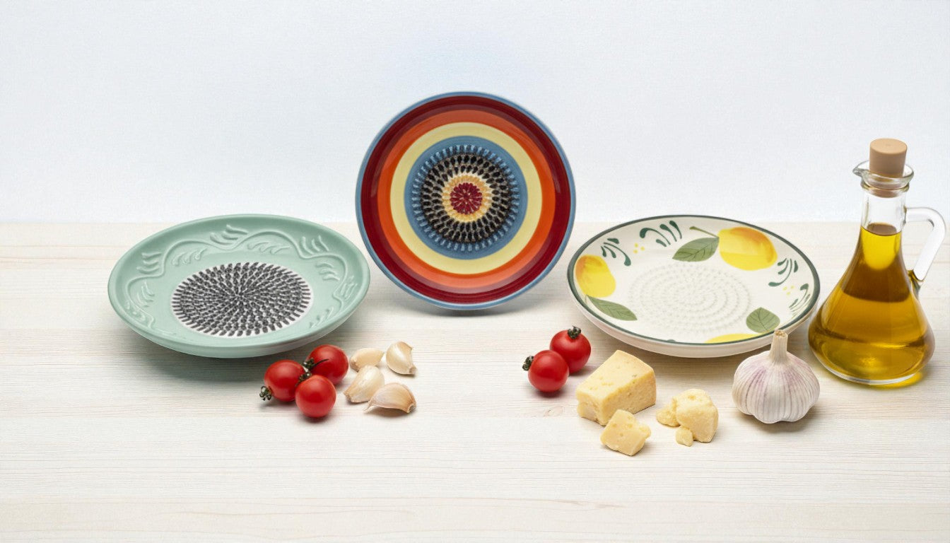 Assorted ceramic plates with colorful designs on a white surface with ingredients.
